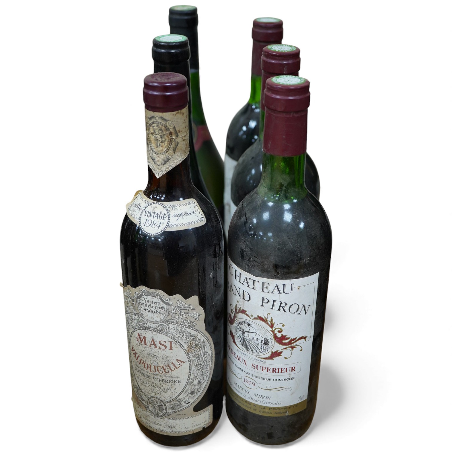 Six bottles of wine including; three bottles of Chateau Grand Piron 1979, two bottles of Marquis de Goulaine 1979 and Masi Valpolicella 1984